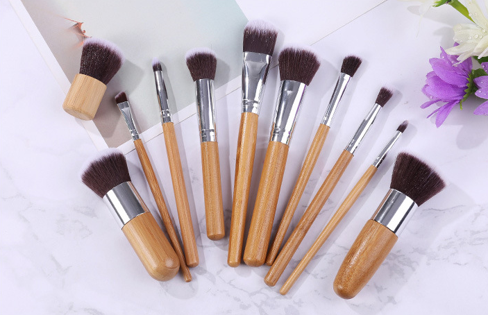 11 bamboo handles, makeup brush, tool set, linen bag, blush brush, foundation brush, and a full set of makeup. - Image 3