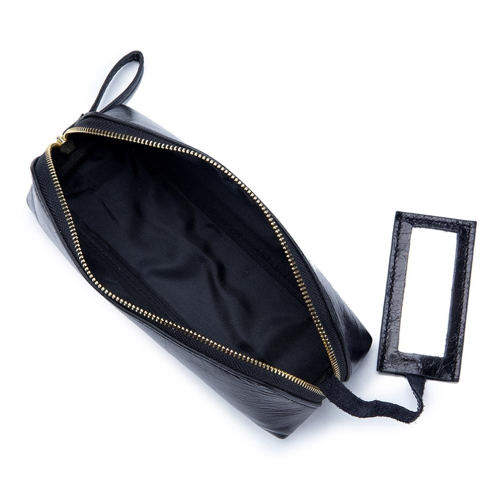 Portable female hand holding cosmetic bag - Image 3