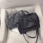 Nubuck leather shoulder bag with rivets