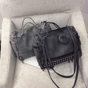 Nubuck leather shoulder bag with rivets