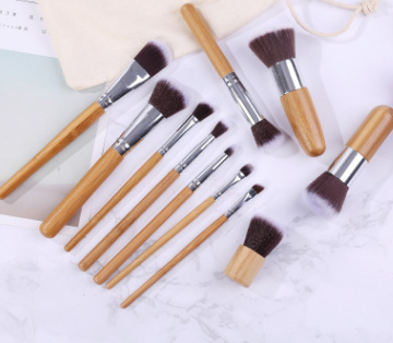 11 bamboo handles, makeup brush, tool set, linen bag, blush brush, foundation brush, and a full set of makeup. - Image 4