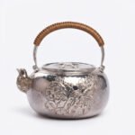 925 Sterling Silver Handcrafted Sterling Silver Floral Teapot with Woven Bamboo Handle and Hammered Texture - Handicraft
